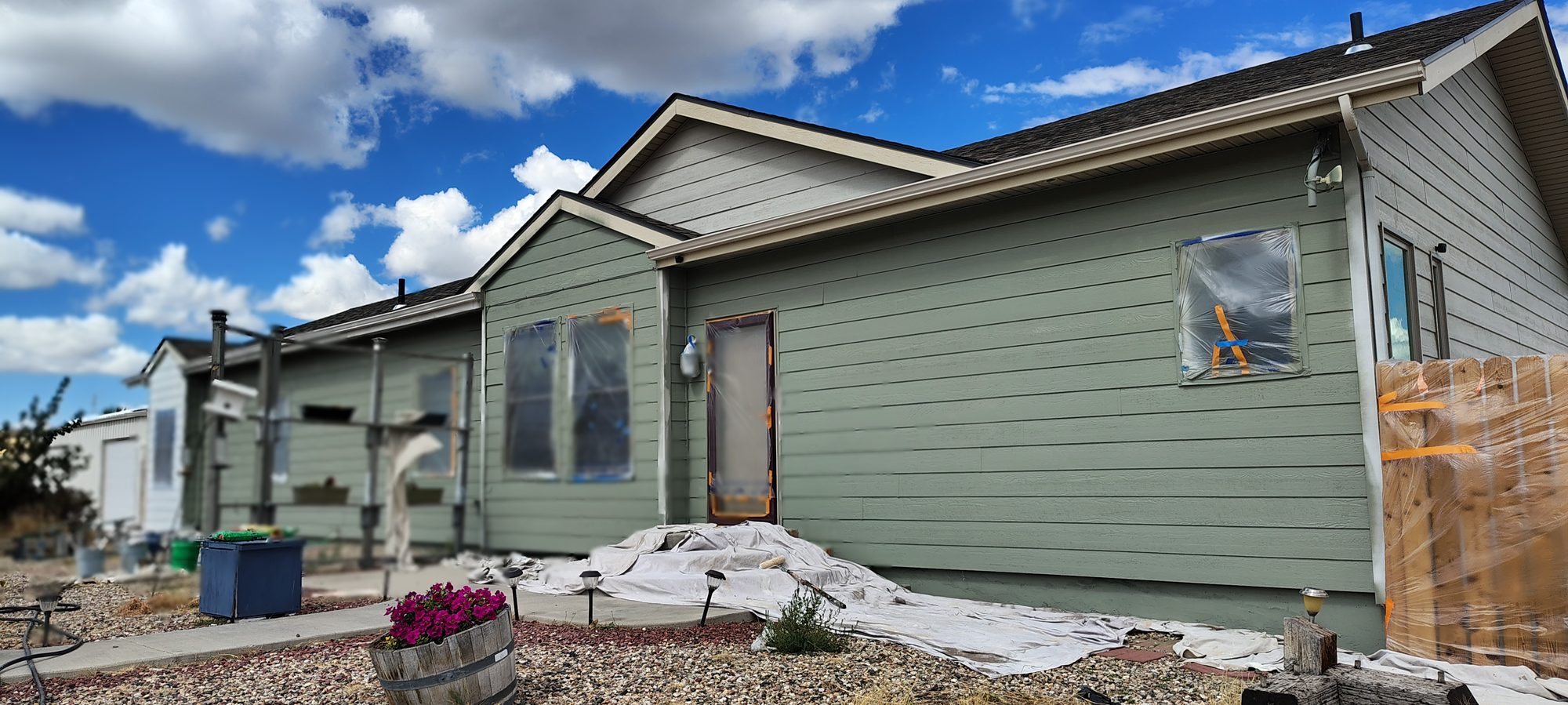 Exterior repaint in progress on a Casper, Wyoming home